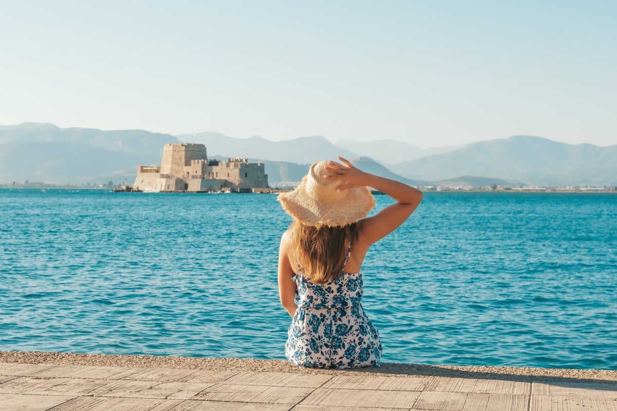 Female tourist posing in front of Nafplio
